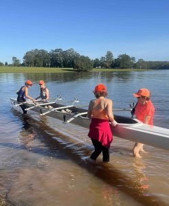 Women lifting boat